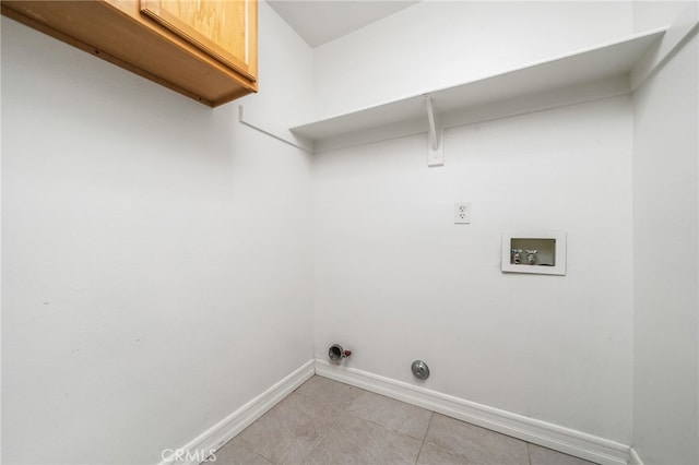 washroom featuring cabinets, hookup for a washing machine, and hookup for a gas dryer