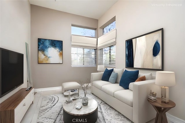 living room featuring a towering ceiling