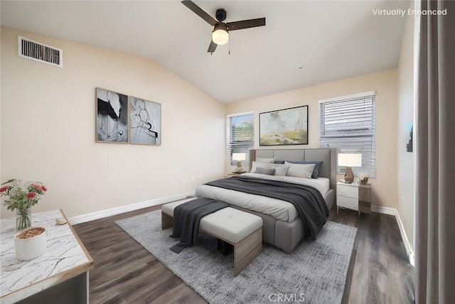 bedroom with ceiling fan, dark hardwood / wood-style flooring, and vaulted ceiling