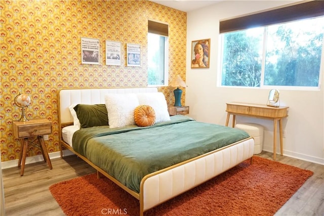 bedroom with hardwood / wood-style floors