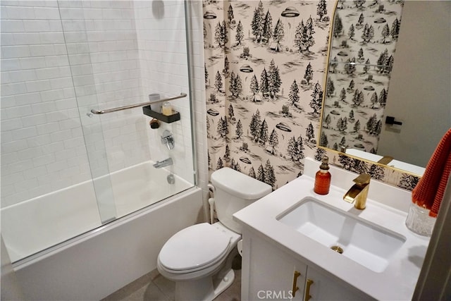 full bathroom with vanity, combined bath / shower with glass door, and toilet