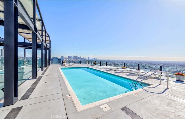 view of pool featuring a patio