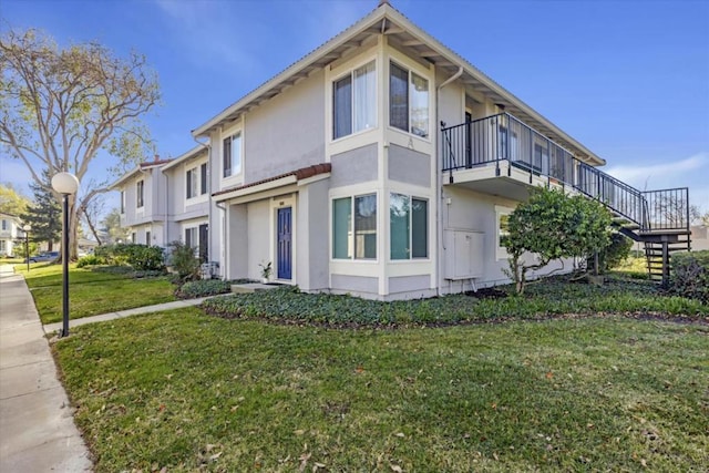 view of home's exterior with a lawn