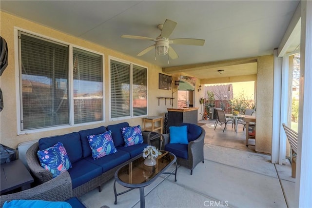 view of patio featuring ceiling fan and outdoor lounge area