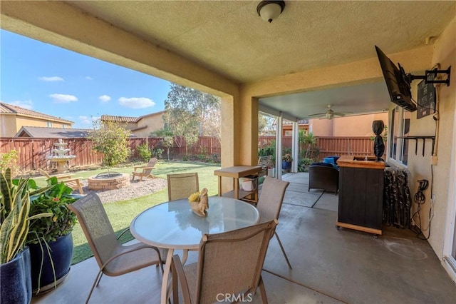 view of patio / terrace featuring a fire pit