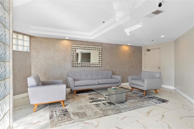 living room featuring a raised ceiling