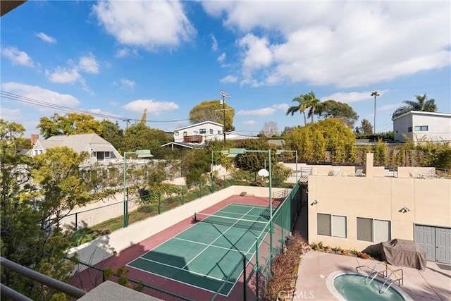 view of basketball court featuring tennis court