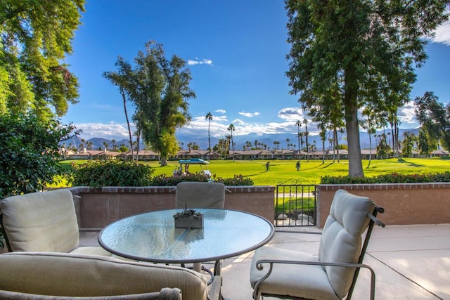 view of patio / terrace featuring a mountain view