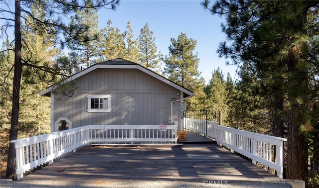 view of home's exterior featuring a wooden deck