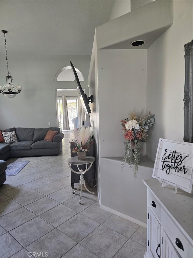 tiled living room with high vaulted ceiling