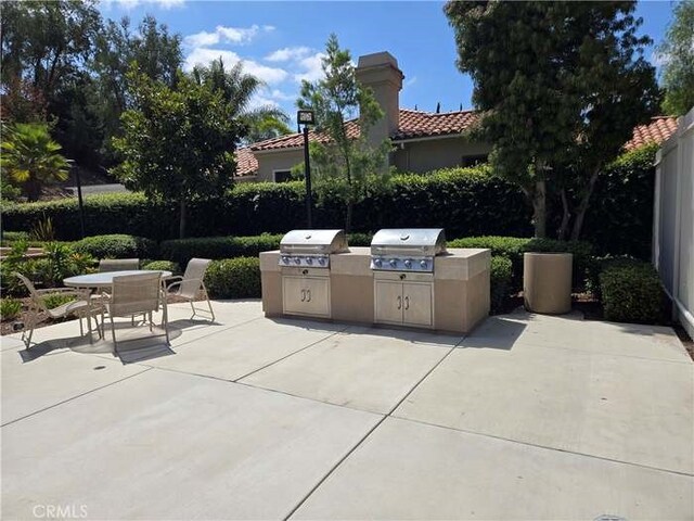 view of patio with exterior kitchen and grilling area