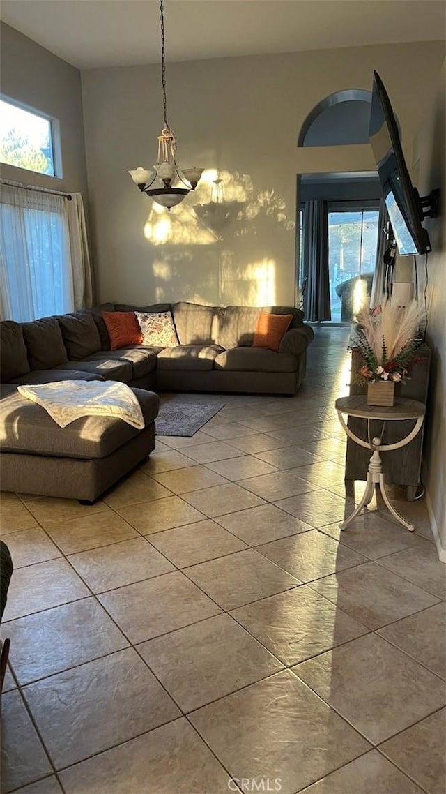 living room featuring tile patterned floors and a healthy amount of sunlight