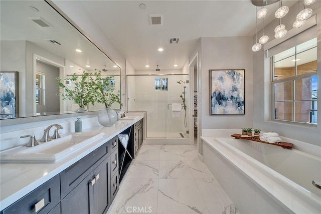 bathroom with shower with separate bathtub and vanity