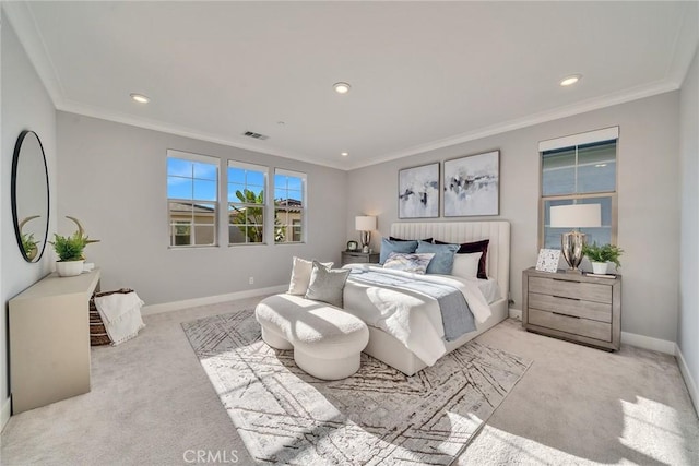 bedroom with crown molding and light colored carpet