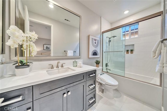 full bathroom with enclosed tub / shower combo, vanity, toilet, and tile patterned flooring