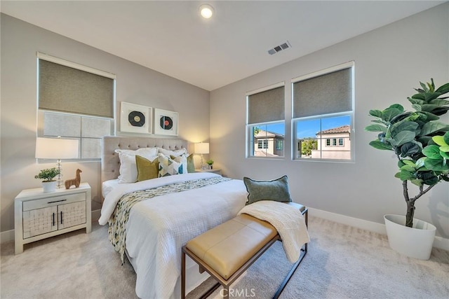 bedroom with light carpet