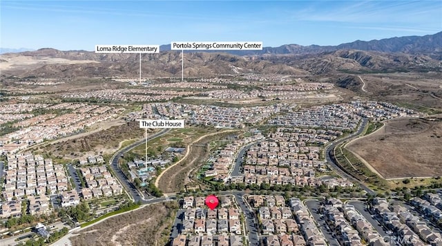 birds eye view of property featuring a mountain view