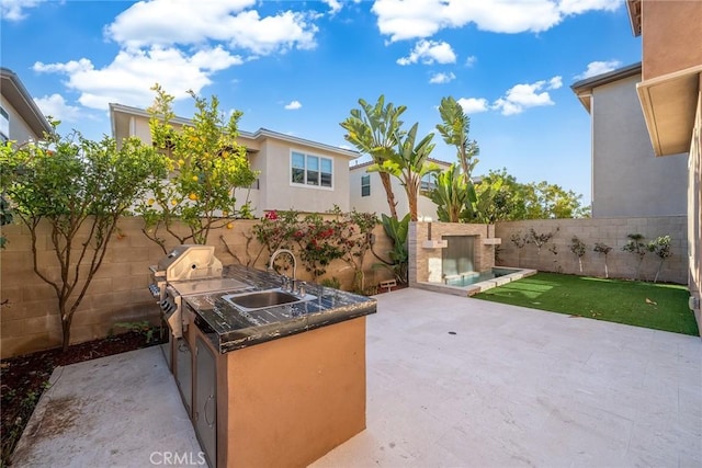 view of patio featuring sink and exterior kitchen