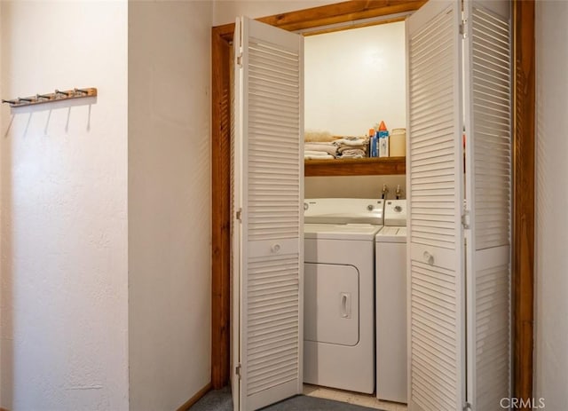 washroom featuring washer and dryer