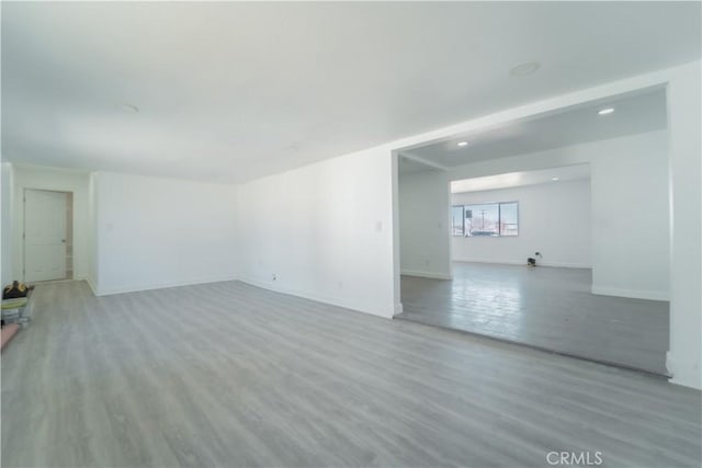 spare room with light hardwood / wood-style floors