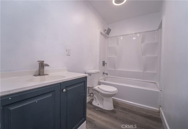 full bathroom featuring hardwood / wood-style flooring, vanity, toilet, and shower / bathing tub combination