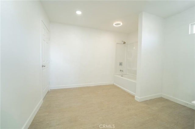 bathroom featuring shower / bathtub combination and wood-type flooring