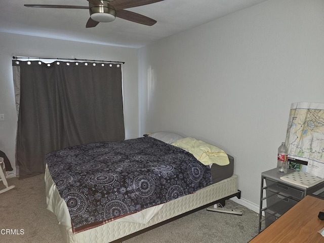 bedroom featuring ceiling fan and carpet floors