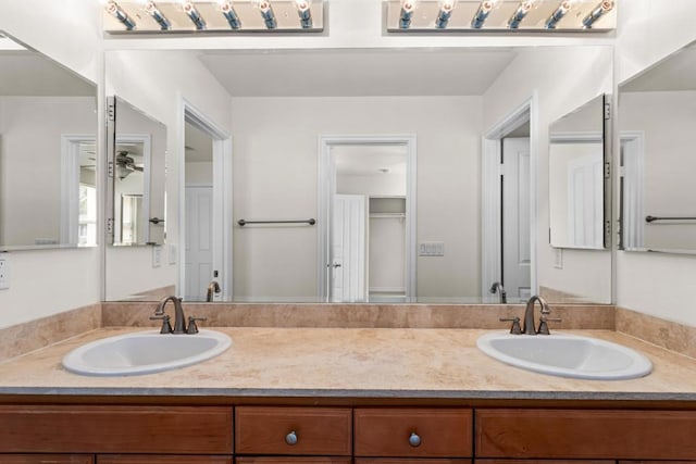 bathroom featuring vanity and ceiling fan