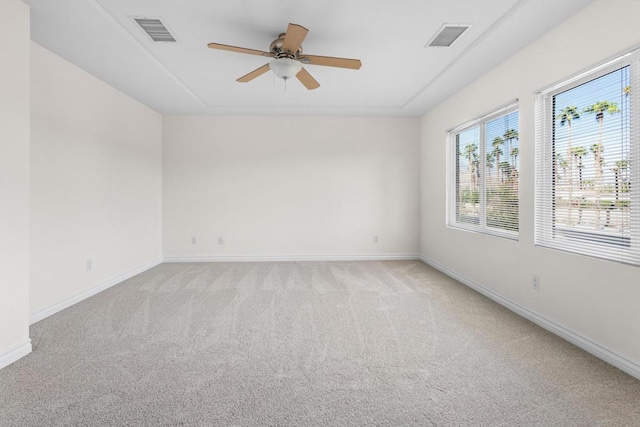 empty room featuring light carpet and ceiling fan