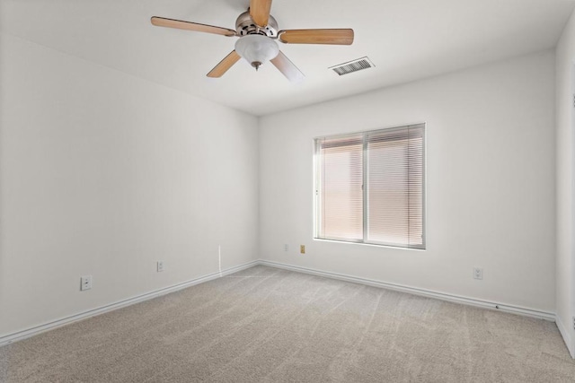 unfurnished room with light carpet and ceiling fan