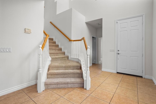 entryway with light tile patterned flooring