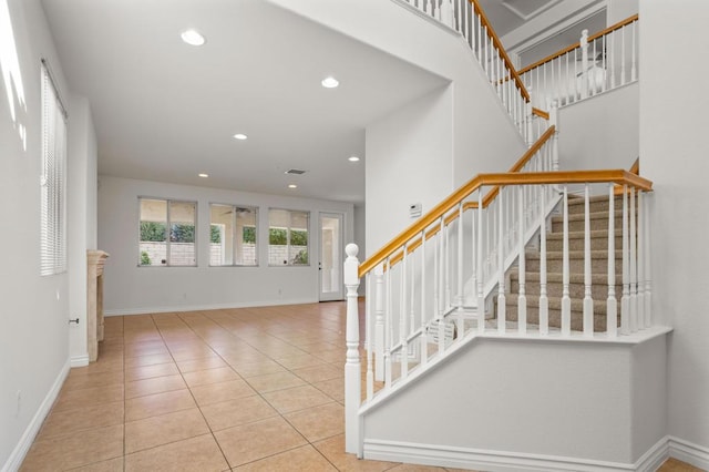 staircase with tile patterned floors