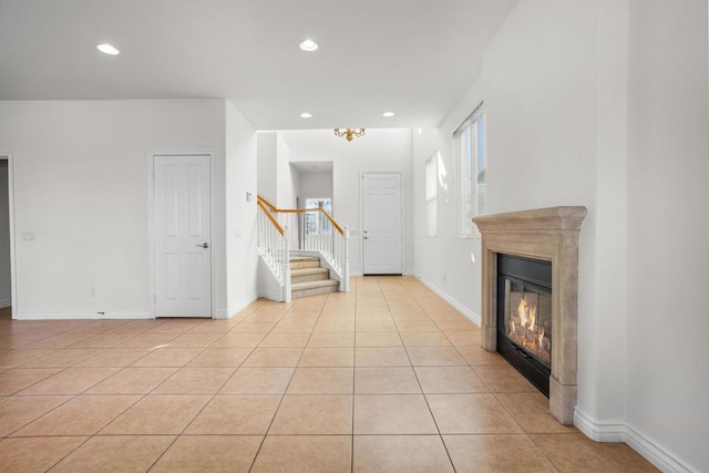 unfurnished living room featuring light tile patterned floors