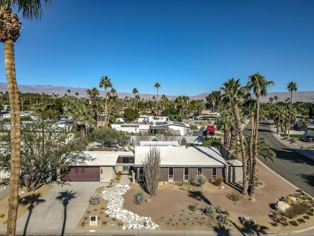 drone / aerial view featuring a mountain view