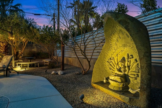 yard at dusk with a patio