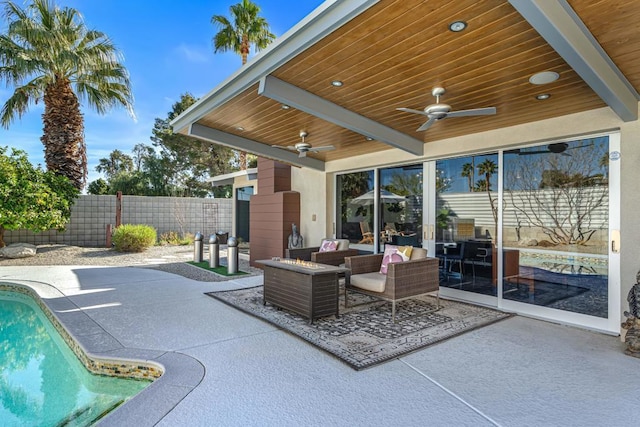 view of patio / terrace with a fenced in pool, ceiling fan, and an outdoor living space