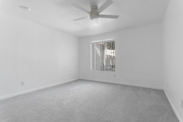 unfurnished room featuring carpet floors and ceiling fan