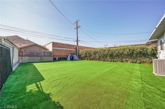 view of yard featuring central AC