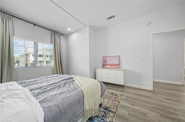 bedroom with light hardwood / wood-style flooring