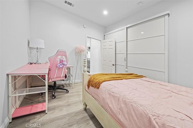 bedroom with a closet and light wood-type flooring