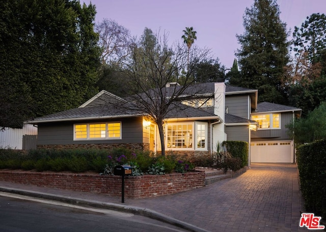 view of front of property with a garage