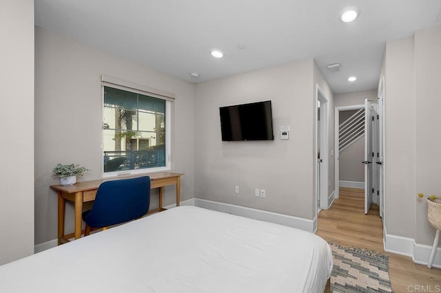 bedroom with light hardwood / wood-style flooring