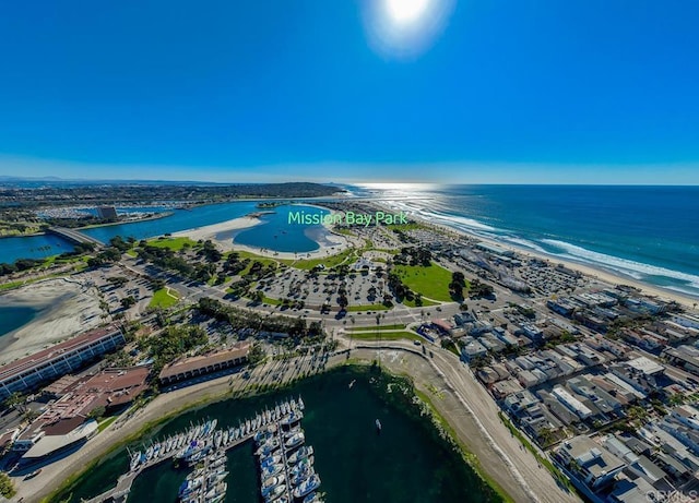 birds eye view of property featuring a view of the beach and a water view