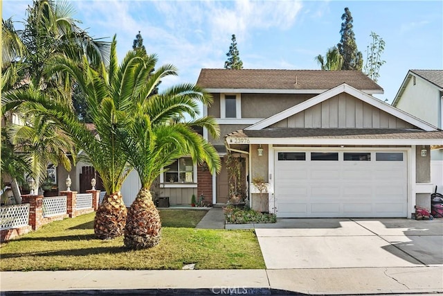 view of front of house featuring a shingled roof, concrete driveway, an attached garage, a front lawn, and stucco siding