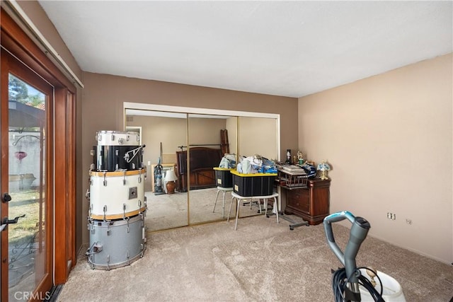 carpeted home office with french doors and water heater