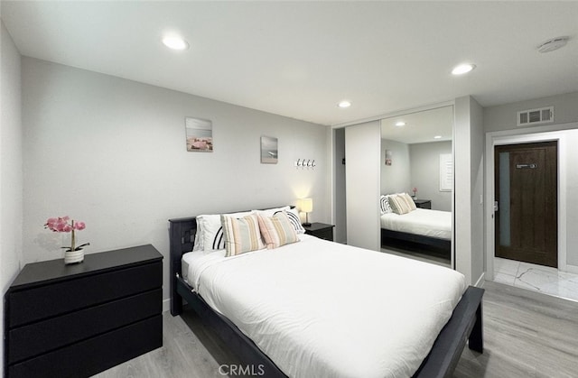 bedroom with light wood-type flooring