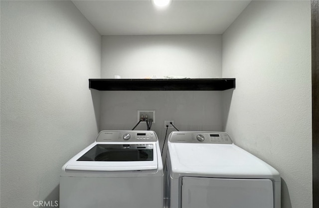 laundry room with washer and clothes dryer