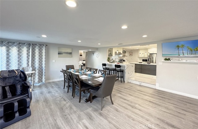 dining room featuring light hardwood / wood-style flooring