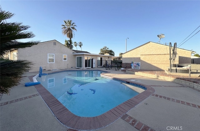 view of swimming pool featuring a patio