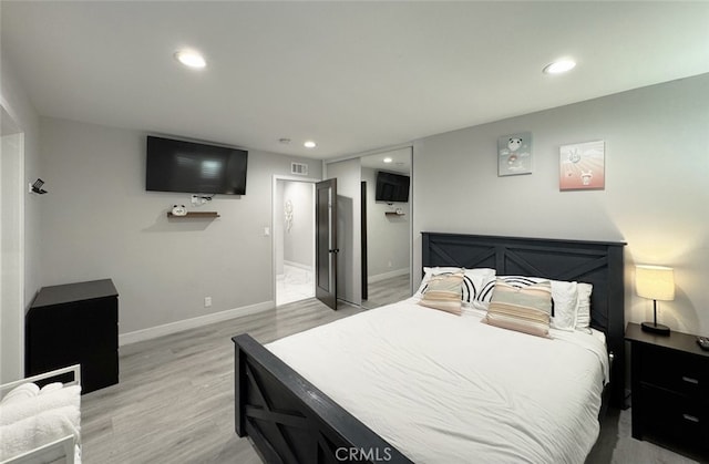 bedroom with light wood-type flooring